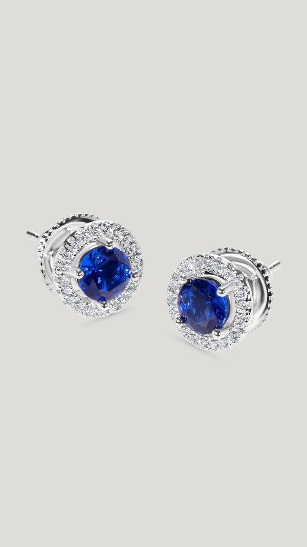 An update on the classic round stud, this pair our intricately cut and polished Round Brilliant centre sapphire stone stud earrings give the ultimate sparkle.