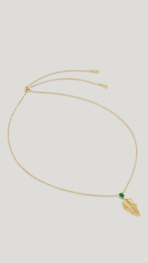 Tropical palm leaf necklace for women featuring an emerald stone. 18k gold vermeil on sterling silver necklace.