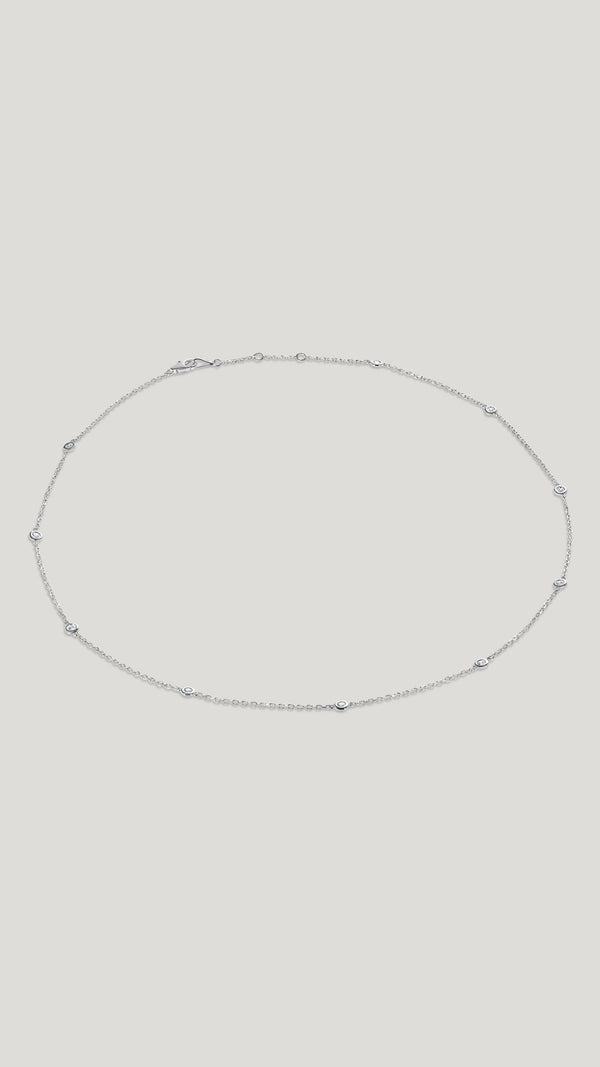 Petra 18k solid white gold station necklace for women.