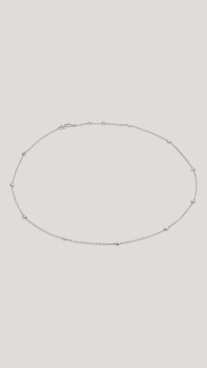 Petra 18k solid white gold station necklace for women.