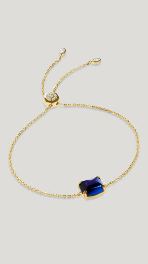 gold slider bracelet for women with recycled sapphire stone from the sugardrop collection