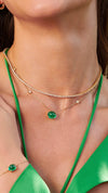 Lexi tennis necklace in gold vermeil with an  emerald cabochon stone of a gold station necklace for wome. 