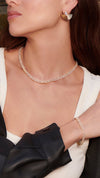 Pavé cuban chained gold necklace and matching bracelet for women with gold fan earrings.