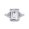 9K White Gold Trilogy Ring - 3ct Emerald Centre Stone, 2 Trillion Side Stones