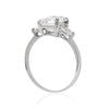 9K White Gold Trilogy Ring - 3ct Emerald Centre Stone, 2 Trillion Side Stones